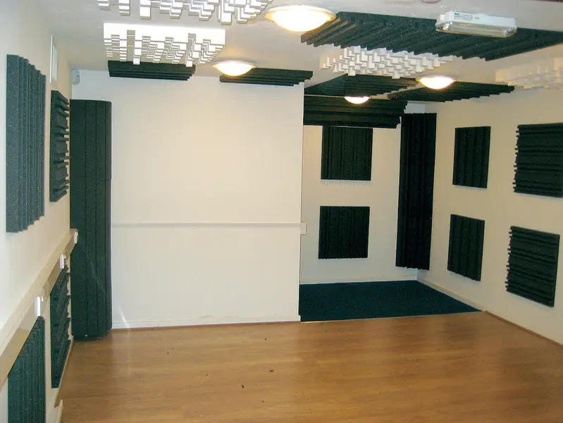 Cheap acoustic treatment layout for small home studio with foam panels and bass traps